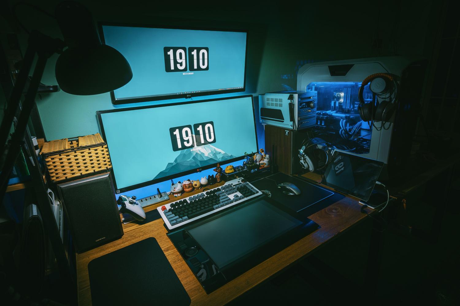 Dual monitor gaming setup in a dimly lit room, ideal for experiencing high refresh rates and fluidity.