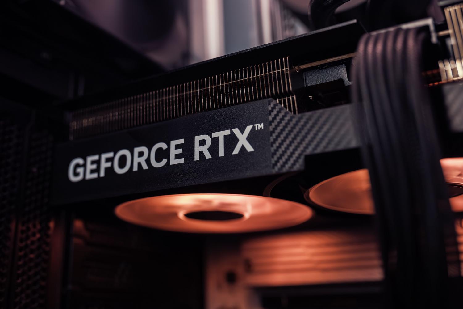 Close-up of a powerful NVIDIA RTX graphics card installed in a gaming PC.